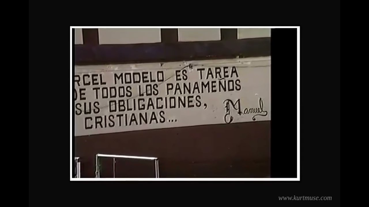 Regime slogan painted across an interior wall of Cárcel Modelo